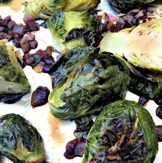 roasted brussels sprouts on a foil lined baking sheet