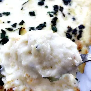 baking dish of cream cheese garlic parmesan mashed potatoes