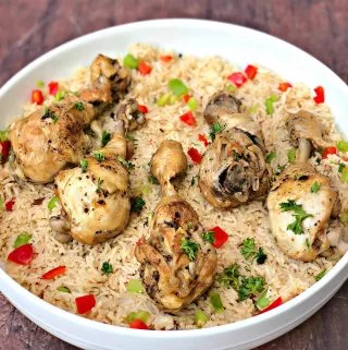 arroz con pollo chicken and rice in a white bowl