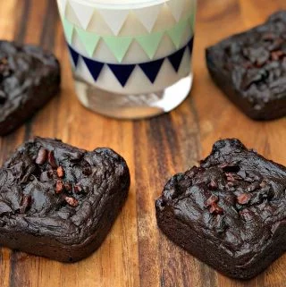 avocado brownies with milk on a brown cutting board