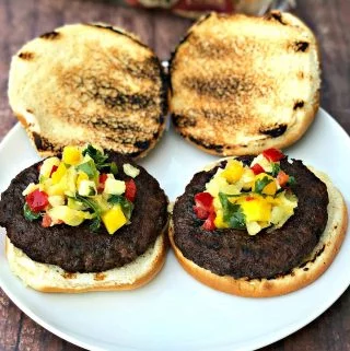 grilled burgers with tropical salsa on a plate