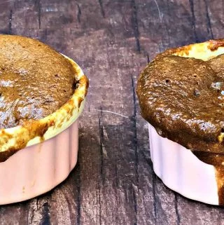 2 servings of keto peanut butter chocolate chip mug cake in pink ramekins