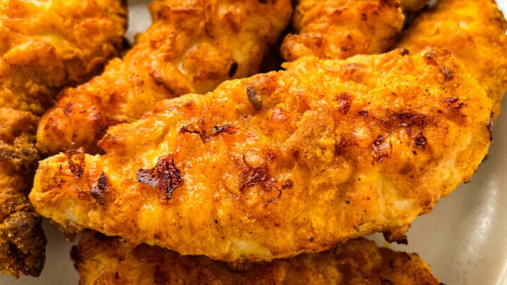 air fryer fried chicken tenders on a white plate