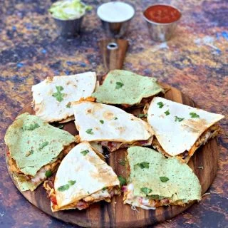 air fryer chicken quesadillas on a brown board