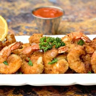 keto low carb breaded shrimp on a white plate