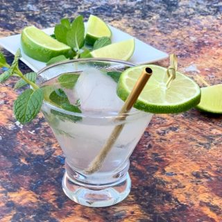 keto low carb mojito drink cocktail in a glass with fresh mint and fresh lime