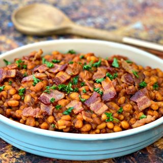 instant pot baked beans with bacon in a blue bowl