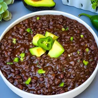 instant pot black bean soup in a white bowl