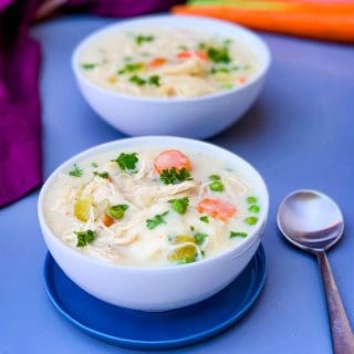 instant pot chicken and dumplings from scratch in 2 white bowls