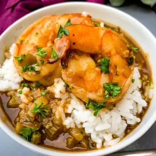 shrimp etouffee with white rice in a white bowl