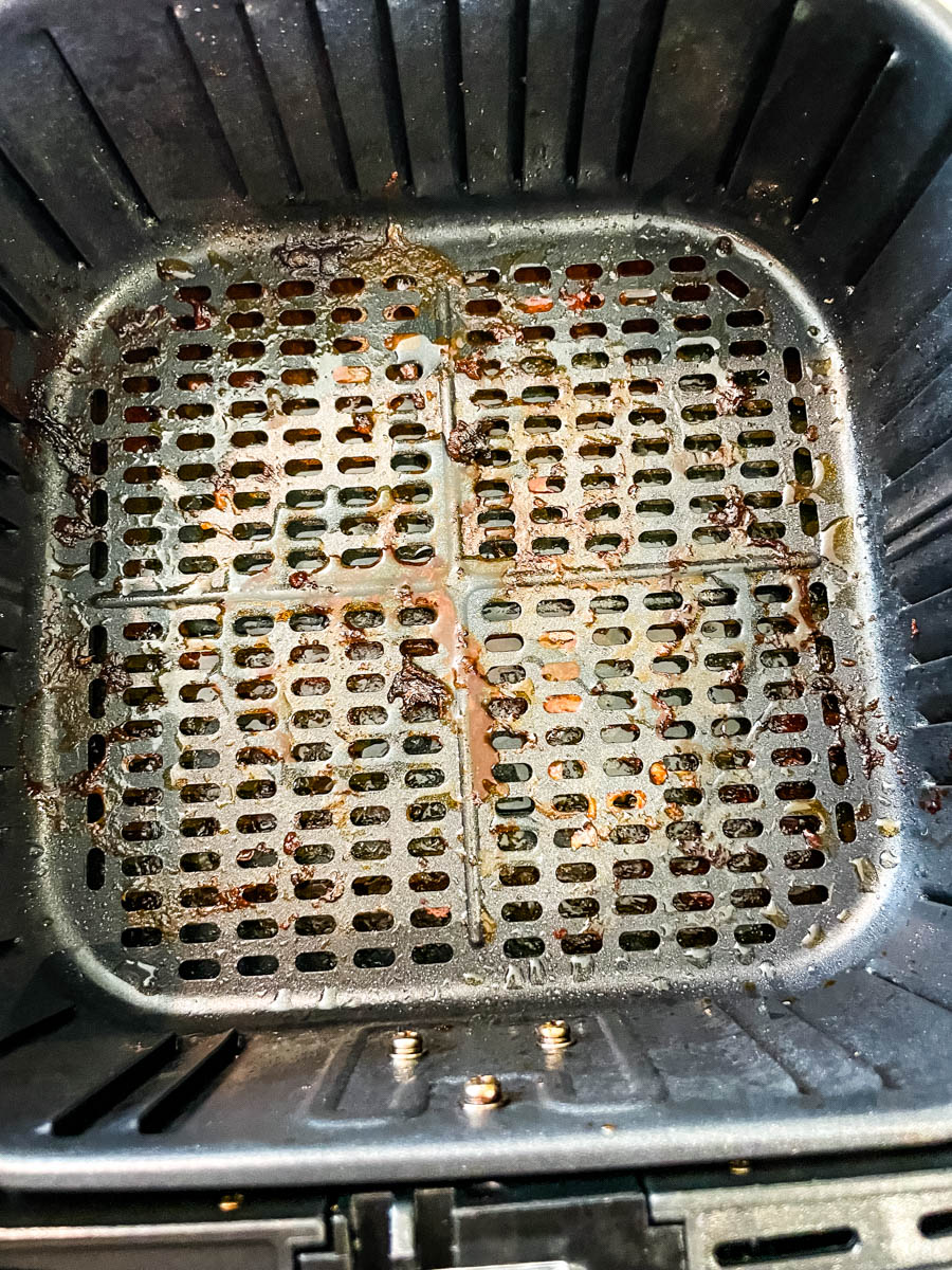 air fryer basket with water and dish liquid