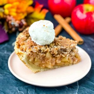 sugar free apple pie on a pink plate with vanilla ice cream