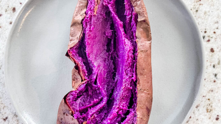 Stokes purple sweet potato fully cooked and sliced open on a plate