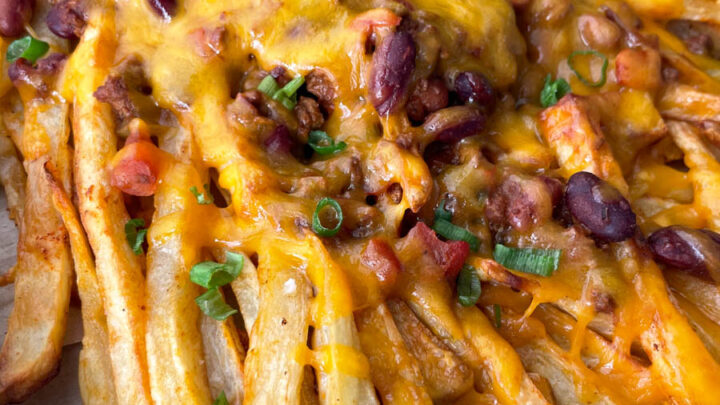 chili cheese fries on a sheet pan