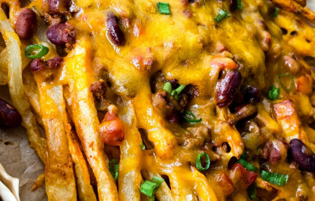 chili cheese fries on a sheet pan