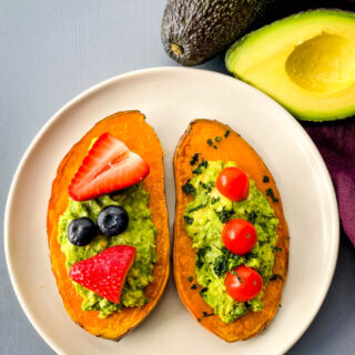 sweet potato avocado toast on a plate with fresh fruit