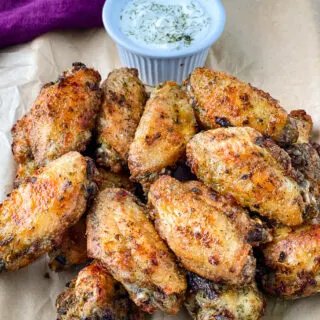 ranch chicken wings on a plate with ranch dressing