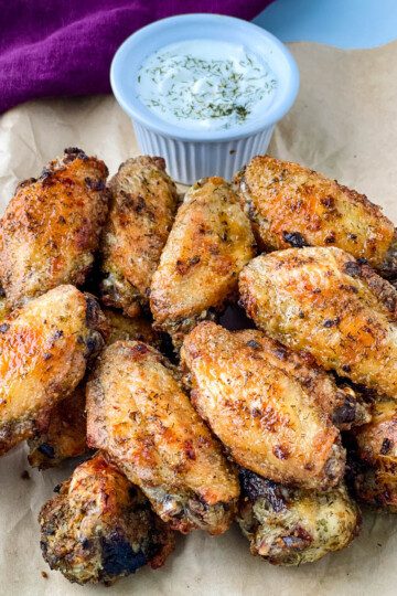 ranch chicken wings on a plate with ranch dressing