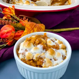 sweet potato casserole with marshmallows in a white dish