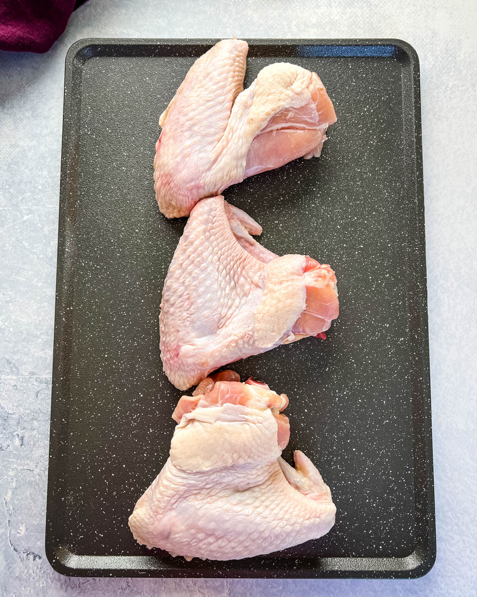 raw turkey wings on a flat surface