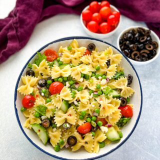 bow tie farfalle pasta salad with vegetables with Italian dressing in a bowl