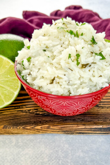 Chipotle cilantro lime rice in a bowl with fresh limes