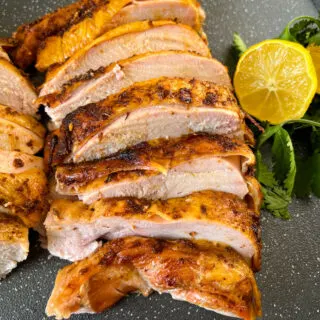 slices of smoked turkey breast on a pan