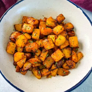 air fryer butternut squash in a white bowl