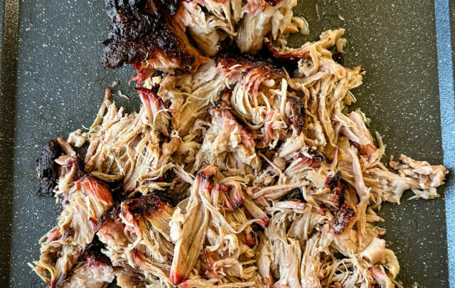 smoked pulled pork and pork shoulder on a sheet pan