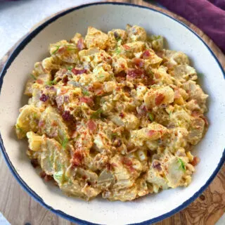 bacon ranch potato salad in a white bowl