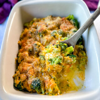 broccoli au gratin with cheese and breadcrumbs in a baking dish