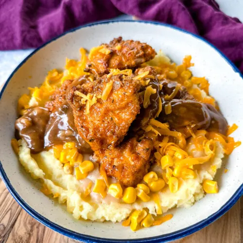 KFC famous mashed potatoes bowl with chicken, gravy, and cheese