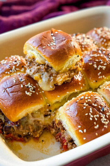 Kings Hawaiian Sliders with cheese in a red baking dish