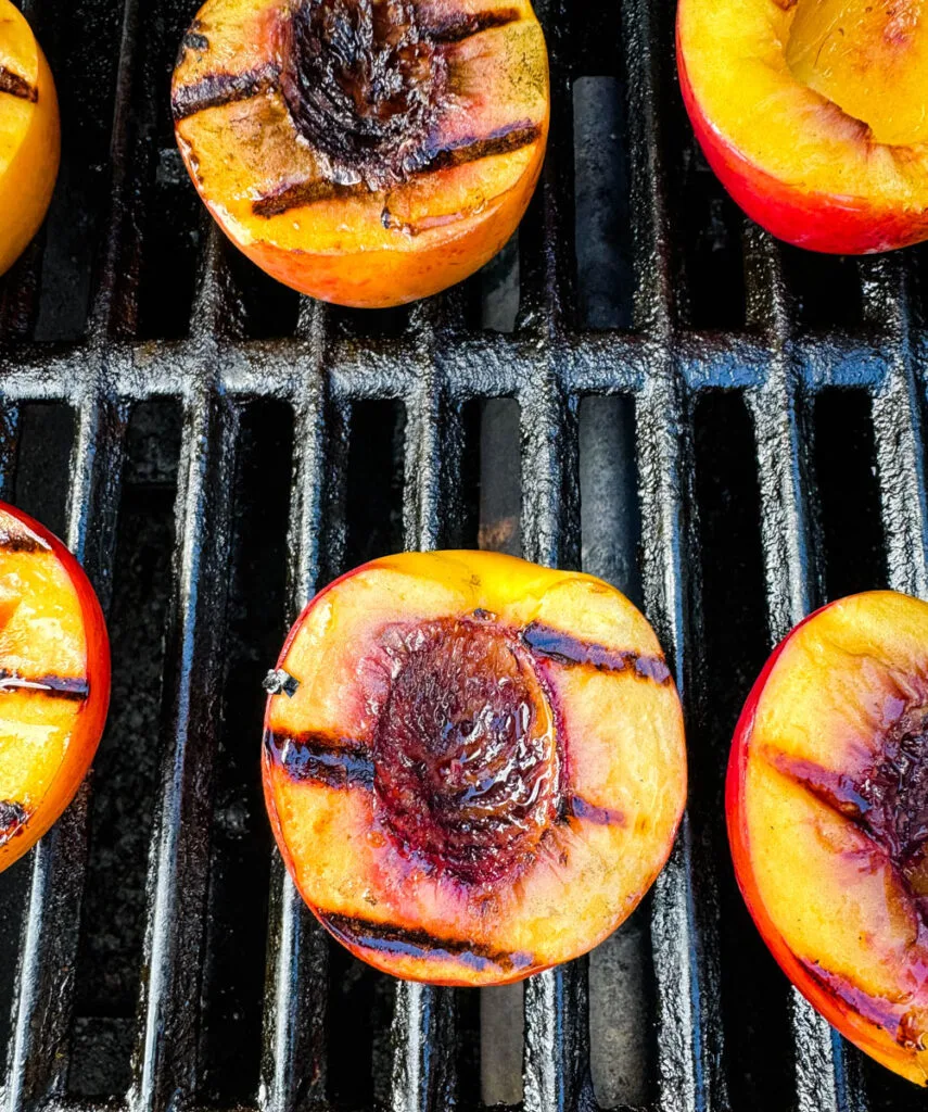 grilled peaches on a grill