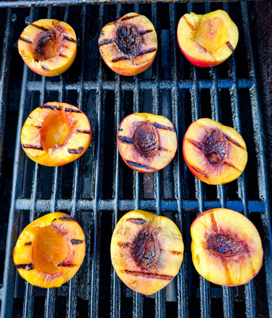grilled peaches on a grill