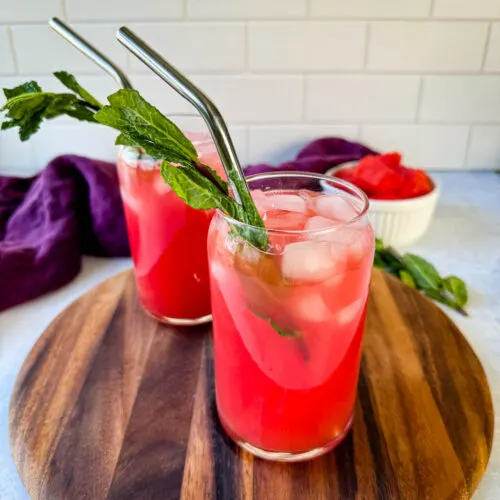 watermelon water in a glass with fresh mint and ice cubes