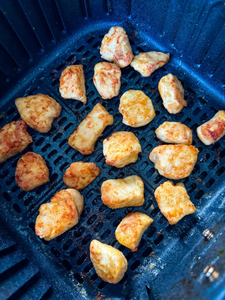 crispy chicken breast pieces in an air fryer