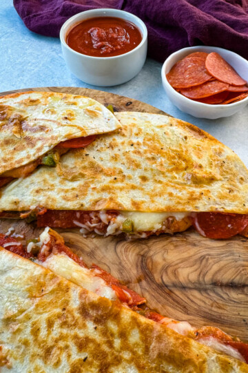 pizza quesadillas with pepperoni on a flat surface