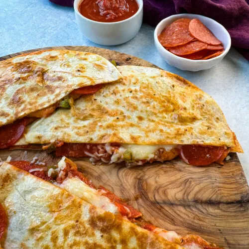 pizza quesadillas with pepperoni on a flat surface