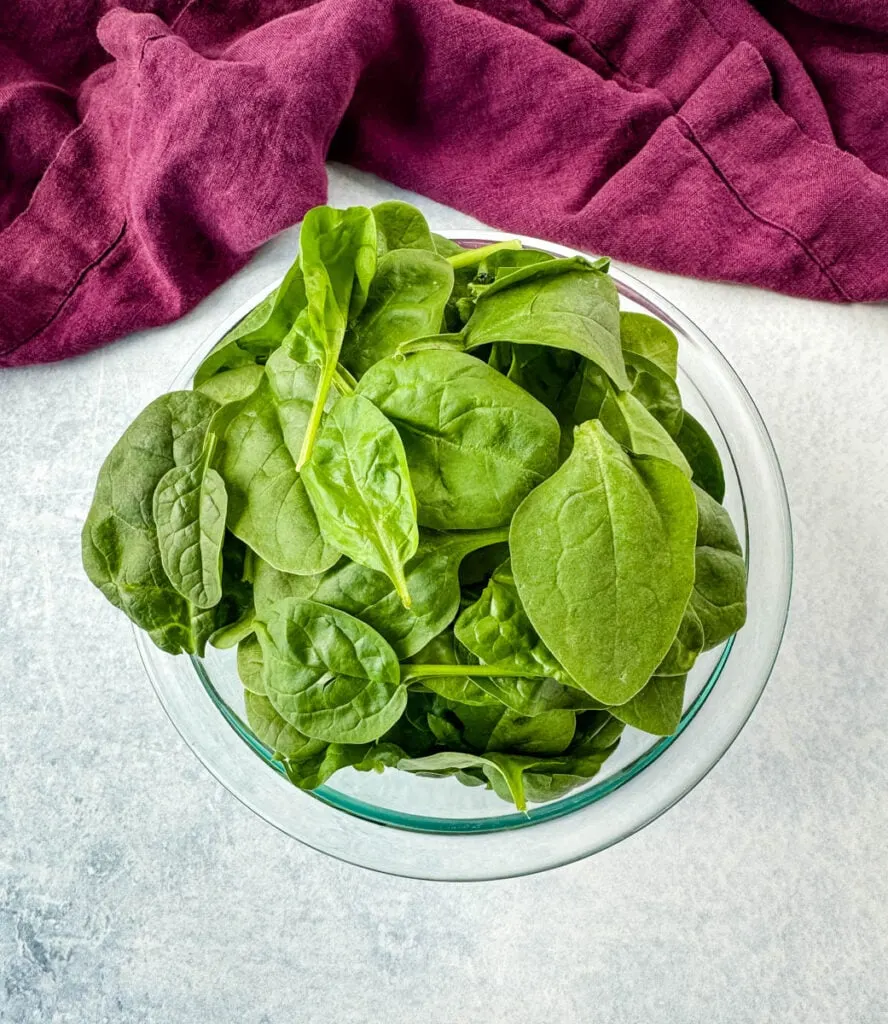 fresh spinach in a glass bowl