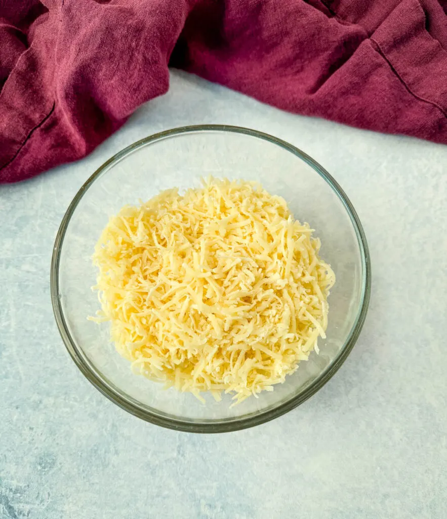 grated parmesan cheese in a glass bowl