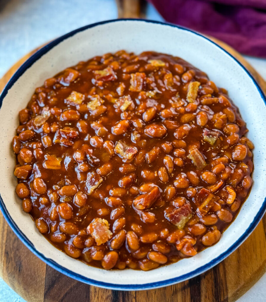 slow cooker Crockpot baked beans in a white bowl 