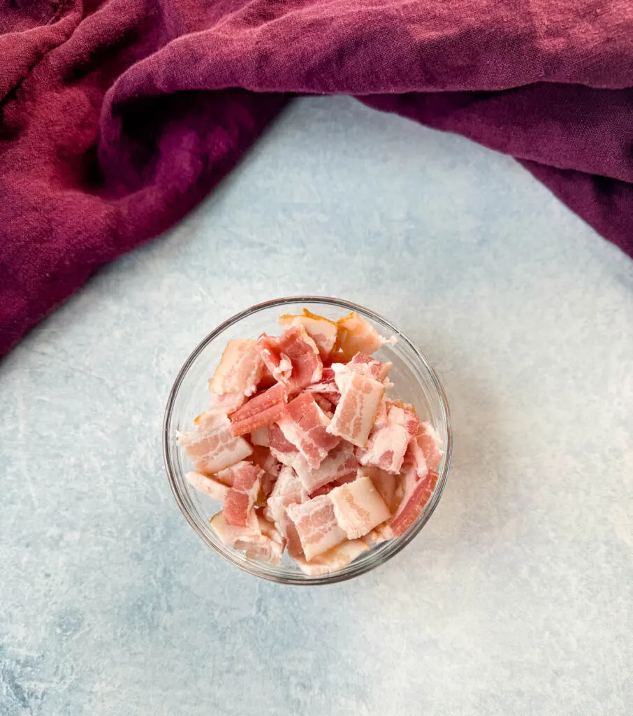 uncooked diced bacon in a glass bowl