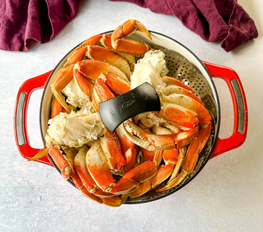 Dungeness crab legs in a steaming basket