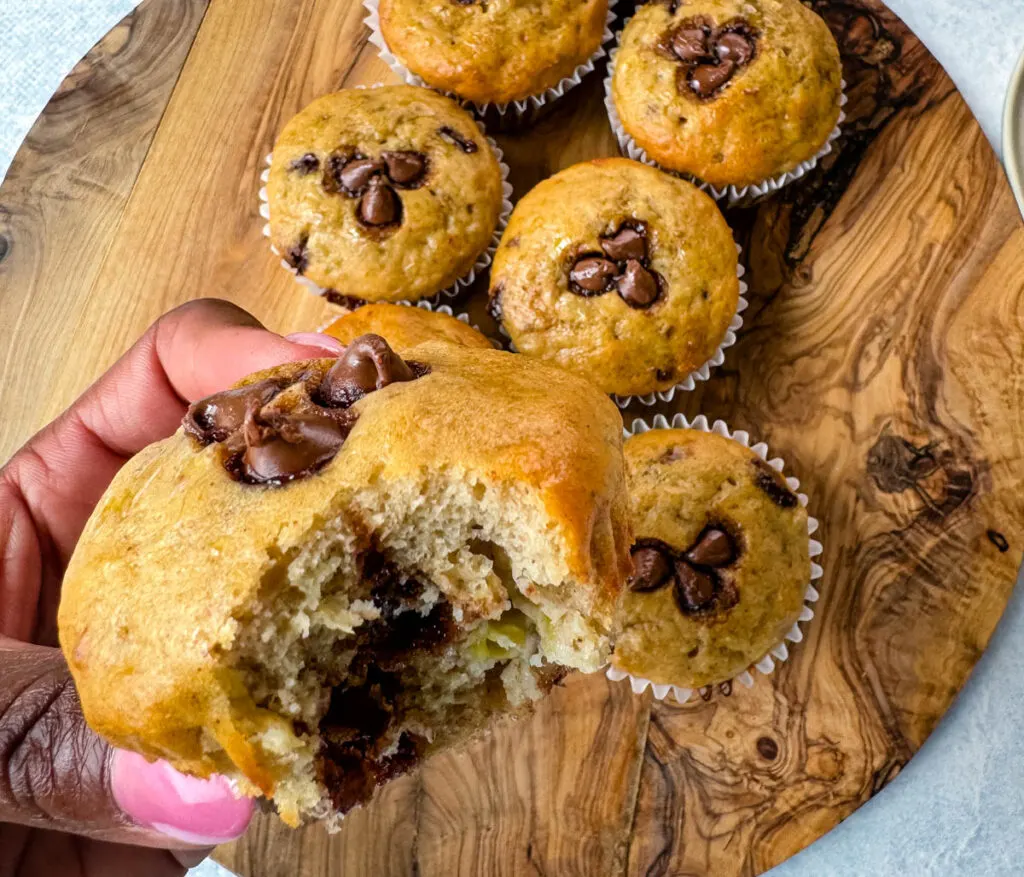 person holding banana protein muffin