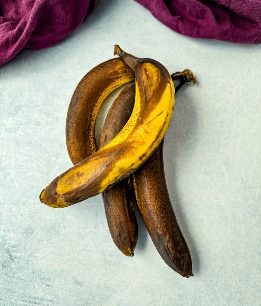 ripe brown bananas on a flat surface