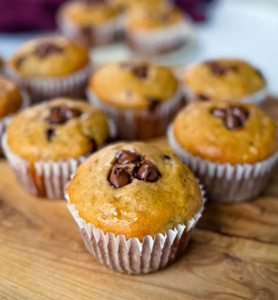 banana protein muffin with chocolate chips on a flat surface