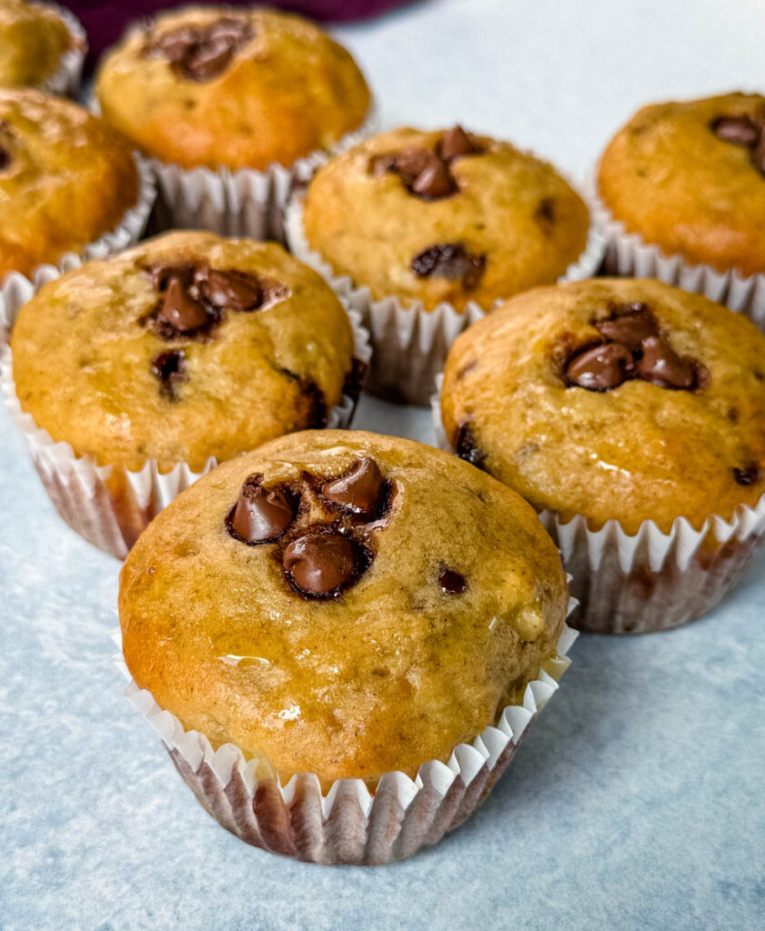 banana protein muffin with chocolate chips on a flat surface