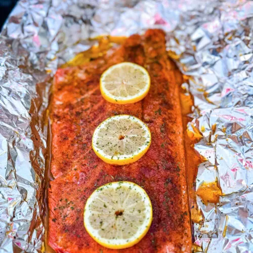 grilled salmon in foil with fresh lemons