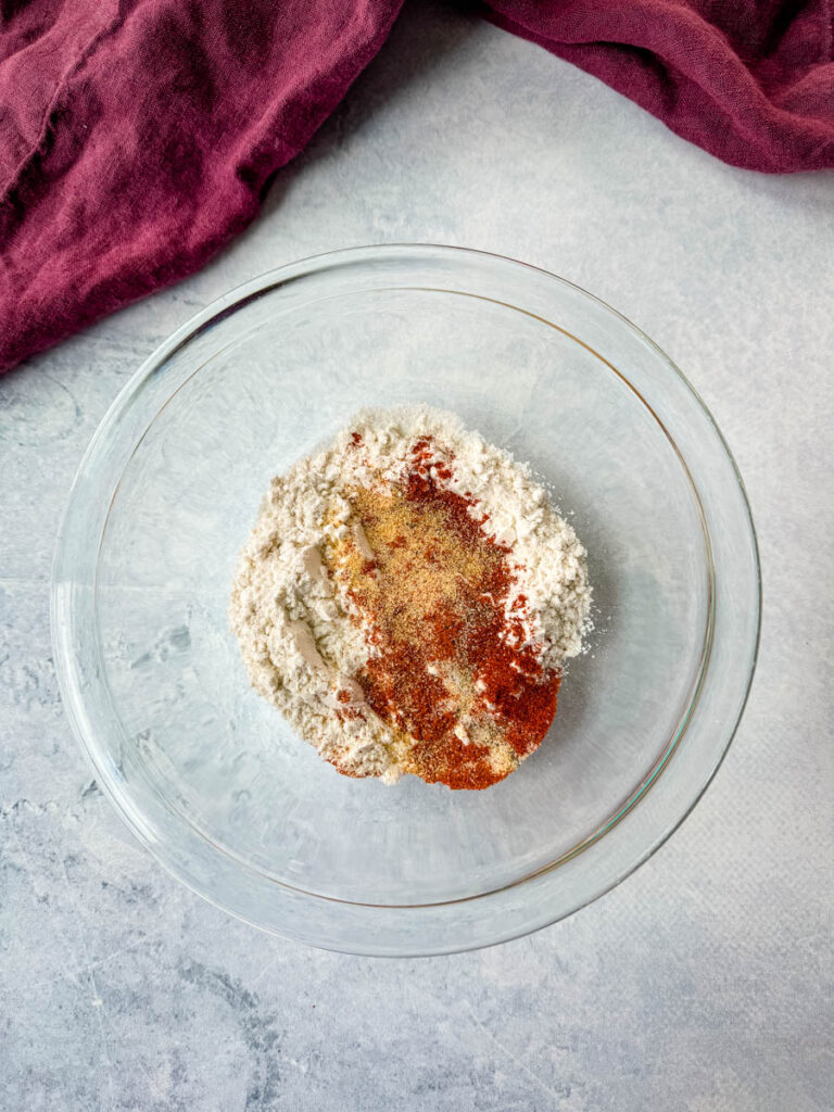 all purpose flour and spices in a glass bowl
